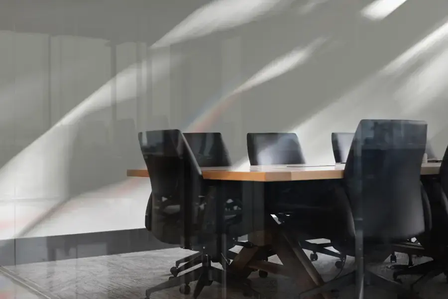 Conference table with black chairs in natural light
